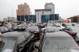 沪私车过户新规出台 二手市场有点淡 竞拍标书或热销